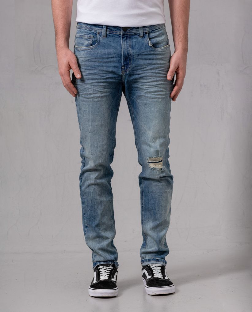 Jean Slim con roto para hombre