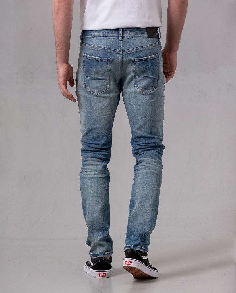 Jean Slim con roto para hombre