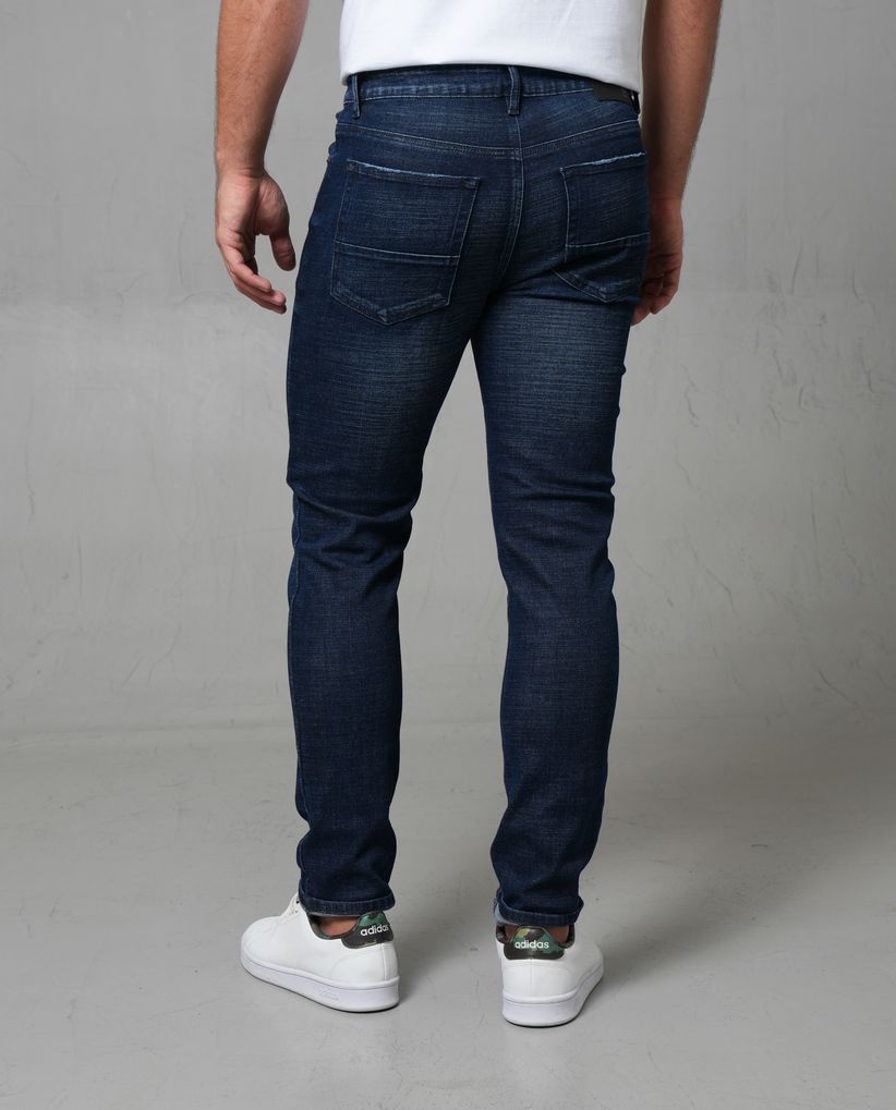 Jean Slim con rotos tono medio para hombre
