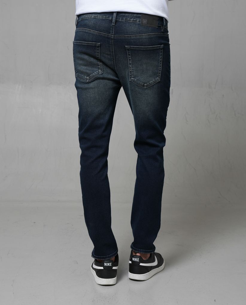 Jean Slim tono oscuro para hombre